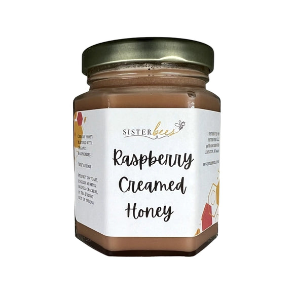 Sweet, simple goodness Sister Bees Michigan Creamed Honey is made with 100% Pure Michigan honey and pure fruit. Only honey & fruit, nothing artificial! Our honey comes packaged in an 8 oz. hexagon glass jar, perfect for you or to gift. Sister Bees Raspberry Creamed Honey is delightful on crackers, toast, English muffins, brie cheese, and straight out of the jar.

8oz
Made in the United States of America