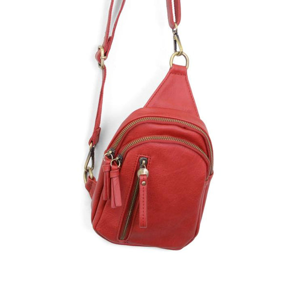 Blending uptown chic with downtown cool, the Skyler sling bag is made in rich red vegan leather! A convertible strap lends versatility, while a front zip pocket offers practical storage for your necessities. It is the perfect companion for a night out on the town or a fun day trip!


8
