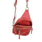 Blending uptown chic with downtown cool, the Skyler sling bag is made in rich red vegan leather! A convertible strap lends versatility, while a front zip pocket offers practical storage for your necessities. It is the perfect companion for a night out on the town or a fun day trip!


8" h x 5.5" w&nbsp; x 2.25" d
Removable and adjustable convertible strap 20"-30" drop
Zippered top closure
Exterior front zip pocket
2 exterior zip compartments
4 interior credit card pockets
Brass plated hardware
100% vegan le
