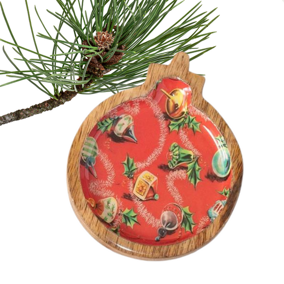These adorable little mango wood ornament dishes will be a hit this year! This round ornament has a retro ornament print in the center. The tray is food safe, so you could put a couple of your homemade chocolates on it and wrap it up as a gift, or use it as a spoon rest - the possibilities are endless!