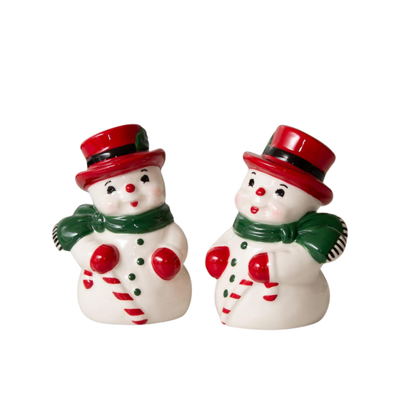 This set of retro snowmen salt & pepper shakers will be the cutest thing on your table (or in your decor) this holiday season!  They have a fun, jolly smile, a red hat and gloves, with a green scarf and buttons going down their bellies.  Each hold a red and white candy cane.

Food Safe

Hand Wash

3.5