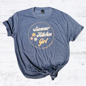 Support your local Girl Gang!!! Get one of our newest Summer Kitchen Girl tees to wear around town.&nbsp;With a fun retro-style font and three flowers off to the side, you'll be the coolest chick around in the soft heathered navy t-shirt!