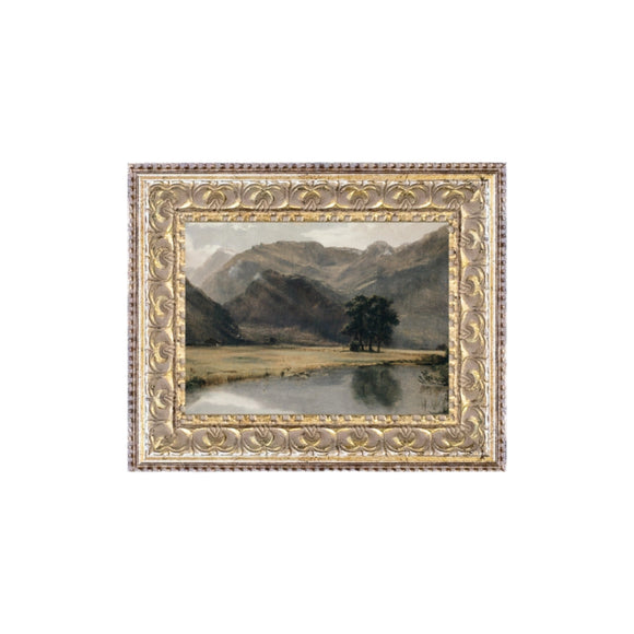 We are obsessed with this little works of art! This beauty has a river in the front with a majestic mountain scene behind it! You'll find lots of places to put this mini artwork! Printed on premium canvas fabric for a lasting, textured finish and has a handcrafted wooden frame that adds a classic charm.  Comes with a paper backing and hanging hardware for easy installation.

Made in the USA: Proudly crafted with quality and care. 

Care Instructions: Keep canvas dry to maintain its quality. If smu