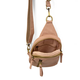 Blending uptown chic with downtown cool, the Skyler sling bag is made in rich rose quartz vegan leather! A convertible strap lends versatility, while a front zip pocket offers practical storage for your necessities. It is the perfect companion for a night out on the town or a fun day trip!


8" h x 5.5" w&nbsp; x 2.25" d
Removable and adjustable convertible strap 20"-30" drop
Zippered top closure
Exterior front zip pocket
2 exterior zip compartments
4 interior credit card pockets
Brass plated hardware
100% 
