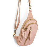 Blending uptown chic with downtown cool, the Skyler sling bag is made in rich rose quartz vegan leather! A convertible strap lends versatility, while a front zip pocket offers practical storage for your necessities. It is the perfect companion for a night out on the town or a fun day trip!


8" h x 5.5" w&nbsp; x 2.25" d
Removable and adjustable convertible strap 20"-30" drop
Zippered top closure
Exterior front zip pocket
2 exterior zip compartments
4 interior credit card pockets
Brass plated hardware
100% 