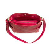 Casual and carefree crossbody in super soft pebble grain vegan leather! Our Kayleigh bucket bag in a beautiful ruby pink&nbsp;comes with a smaller bag that can be carried inside or used alone! The convenient side pockets of this bucket bag can carry your water bottle, phone or glasses.&nbsp;


11" W X 11.25" H X 3.5"
Magnetic Snap Closure
2 open and 1 zipper interior pockets
2 exterior open pockets and 1 back zipper pocket
12- 18" adjustable drop and detachable crossbody strap with lobster claw clasps
Brush