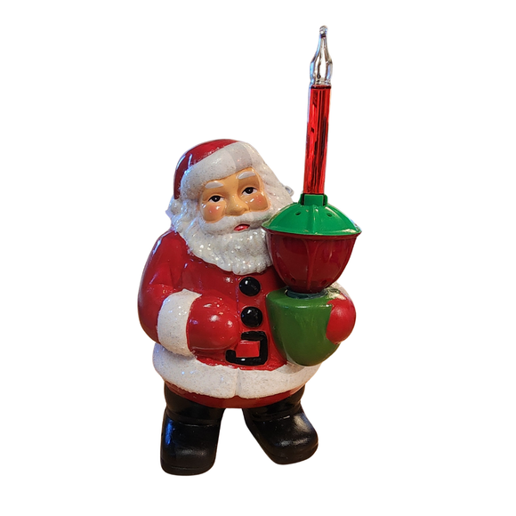 Bring back the nostalgia and memories of holidays gone by with this 1950's vintage-inspired bubble light Santa. Made of hand-glazed resin. electrically wired glass bubble light, and glitter accents. Includes light. 

Materials: Glazed resin. Electrically wired bubble light. Includes light. This item plugs into any US outlets.

Dimensions: 7
