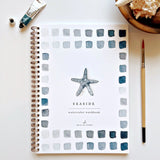 Watercolor workbooks are just like a coloring book, but with watercolor! Enjoy this peaceful hobby on your own, with kids, and with friends. Makes a wonderful gift. Perfect for artists of any age. This Seaside book has beautiful illustrations of boats, crabs, anchors, oars and more for you to paint!

12 beginner-friendly, lightly sketched illustrations

Simple step-by-step instructions and example

Lay flat spiral pages for easy painting

Durable 120 lb watercolor paper

Travel ready 6.5 inch x 9 inch size
