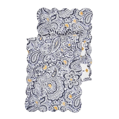 This beautiful quilted runner will bring happiness to your home with a gorgeous floral paisley design in denim on a white background with touches of yellow. It reverses to a denim block print with yellow floral designs on top of a white background. It will easily brighten any tablescape. Finished with a scalloped edge, this tabletop collection is crafted of 100% cotton and hand-guided machine quilting.