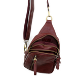 Blending uptown chic with downtown cool, the Skyler sling bag is made in rich dark cherry vegan leather! A convertible strap lends versatility, while a front zip pocket offers practical storage for your necessities. It is the perfect companion for a night out on the town or a fun day trip!


8" h x 5.5" w&nbsp; x 2.25" d
Removable and adjustable convertible strap 20"-30" drop
Zippered top closure
Exterior front zip pocket
2 exterior zip compartments
4 interior credit card pockets
Brass plated hardware
100% 