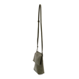 With a slim, streamlined look, this vegan leather crossbody in a beautiful dark olive color features a top flap with magnetic snap closure and an adjustable shoulder strap so you can carry it as a crossbody or a shoulder bag. With two convenient slip pockets, one under the flap and one on the back you can keep your phone and keys in easy reach.


Dimensions: 9.5 in. H x 8 in. W x 2.75 in. D
Magnetic snap closure
Adjustable shoulder strap: 14 in. - 27.5 in. drop
Brass plated hardware
100% Vegan leather (poly
