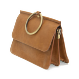 Put a ring on it! Perfect for your next night out, this cute scotch bracelet bag looks great with your fav jeans or slinky dress! With multiple compartments, it is just the right size to hold all your essentials. Wear it on your wrist with the metallic ring bracelet, or carry as a clutch, or wear as a crossbody with the detachable shoulder strap.


Dimensions: 6 in. H x 8.25 in. W x 3.5 in. at deepest point
Tapers up to the top point
Adjustable and removable crossbody strap: 20-25 in.
3 in. diameter ring th