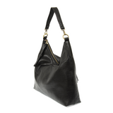 This oversized, slouchy, cool hobo bag is made of tumbled buffalo grain black vegan leather, which gives it that casual boho chic look! With two included removable shoulder straps, you can wear it as a short shoulder bag or a crossbody bag.  Dimensions: 13.5 in. H x 16 in. W x 3.5 in. D