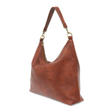 This oversized, slouchy, cool hobo bag is made of tumbled buffalo grain cinnamon-colored vegan leather, which gives it that casual boho chic look! With two included removable shoulder straps, you can wear it as a short shoulder bag or a crossbody bag.