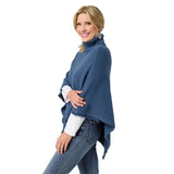 The epitome of cozy, this everyday luxury poncho is crafted from a soft knit fabric in stellar blue, with a rich cable texture that adds depth and dimension. Designed with a relaxed drape and a comfortable turtleneck, it delivers effortless warmth while maintaining an elevated, easy silhouette. The lightweight feel allows for comfortable layering without bulk, making it a versatile piece for both casual and polished styling. Soft. Luxe. and made for all day comfort, this poncho brings refined ease and timel