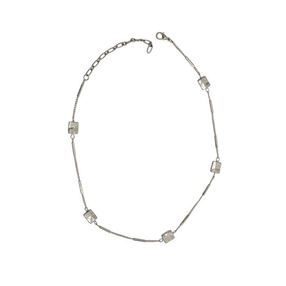 Add this silver necklace to your wardrobe! There is a lot of fun detail with the rectangular hammered shapes in between a petite link chain and silver bars. It is 15