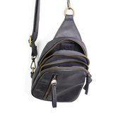 Blending uptown chic with downtown cool, the Skyler sling bag is made in deep charcoal vegan leather! A convertible strap lends versatility, while a front zip pocket offers practical storage for your necessities. It is the perfect companion for a night out on the town or a fun day trip!


8" h x 5.5" w&nbsp; x 2.25" d
Removable and adjustable convertible strap 20"-30" drop
Zippered top closure
Exterior front zip pocket
2 exterior zip compartments
4 interior credit card pockets
Brass plated hardware
100% veg