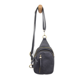 Blending uptown chic with downtown cool, the Skyler sling bag is made in deep charcoal vegan leather! A convertible strap lends versatility, while a front zip pocket offers practical storage for your necessities. It is the perfect companion for a night out on the town or a fun day trip!


8" h x 5.5" w&nbsp; x 2.25" d
Removable and adjustable convertible strap 20"-30" drop
Zippered top closure
Exterior front zip pocket
2 exterior zip compartments
4 interior credit card pockets
Brass plated hardware
100% veg