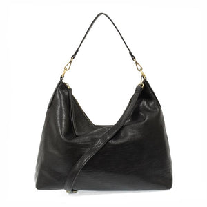 This oversized, slouchy, cool hobo bag is made of tumbled buffalo grain black vegan leather, which gives it that casual boho chic look! With two included removable shoulder straps, you can wear it as a short shoulder bag or a crossbody bag.  Dimensions: 13.5 in. H x 16 in. W x 3.5 in. D