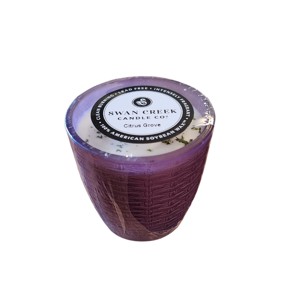 You'll love our cathedral small vase candle. This citrus grove candle has been poured into a pretty basketweave frosted purple glass.

 Vibrant nuances of Tangerine, Mandarin & Cassis shine on top. Traces of Red Currants, Guava, and Lemon Flower sweet throughout. Bottom notes of green Ivy & Lily add to Vanilla Sugar for the finishing touches.

Filled with 4.5 oz. of American Soybean WaxTM. Measures 3