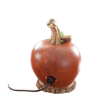 Lucas is our orange colored Jack-O-Lantern with a pumpkin stem.  Comes with a green gourd leaf and electric light.  Approximately 5" in diameter and 6" tall. 

Warning: Gourd are flammable. Do not use candles in them or place near open flames.