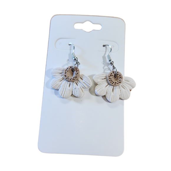 You will love these lightweight, trendy polymer clay daisy earrings that are the cutest! This one has five textured petals in cream with earring hooks are comfortable and easy to wear and made of high-quality, strong/durable stainless steel, which is hypoallergenic and nickel-free. * 

This versatile earring design would accompany any outfit, from casual to dressed up! 

Handcrafted in Texas, USA 

CARE INSTRUCTIONS FOR EARRINGS * Store in a clean, dry place. * To clean: rub gently with a sof