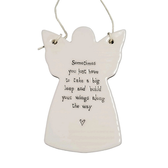 You'll love to give one of these angel-shaped porcelain ornaments to someone special! They have a cord tied to the wings so that it can hang if you would like. The words 