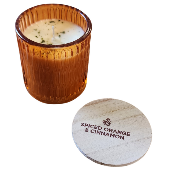 You'll love our newest cathedral glass tumbler! This crisp cotton has been poured into a pretty orange patterned glass and comes with a wooden lid.

Cinnamon, Crushed oranges and some notes of nutmeg and allspice, this is a perfect citrus fragrance!

Filled with 6.5 oz. of American Soybean WaxTM. Measures 3.25