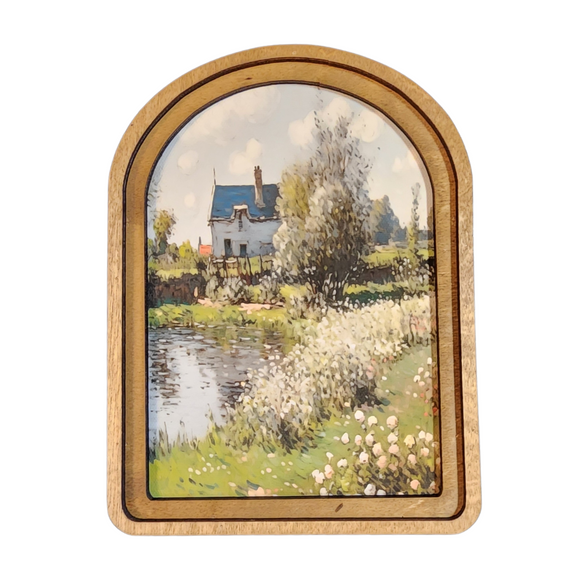 What a breathtaking scene of spring in bloom! With a path to the right along a pond that leads to a sweet cottage in the back with lots of trees loaded with white flowers in front of it, it will be a favorite of yours for years to come.

This unique artwork is printed onto canvas using high quality Canon pigment inks. The canvas is then mounted onto a wood backer. This piece has a double layered wood frame stained in a neutral Early American tone. This piece can be hung on a wall using an adhesive strip or 