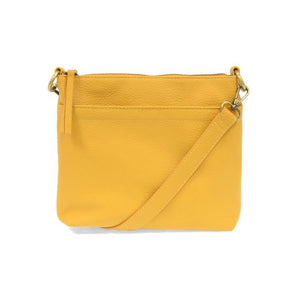 Your perfect goes with anything bag! In just the right size to carry your essentials, this sunflower yellow pebbled vegan leather bag has multiple pockets and a top zip closure for security, so you are ready for anything your day brings. Add one of our interchangeable Guitar Straps to add your own style!


Product Details
Dimensions: 11 in. W x 11.25 in. H x 3.5 in. D
Magnetic Snap Closure
2 Open and 1 Zipper Interior Pockets
2 Exterior Open Pockets and 1 Back Zipper Pocket
12x18 in. Drop Adjustable and Det