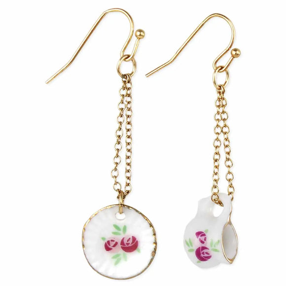 Teatime in the park? These adorable tiny tea pitcher and saucer linear chain earrings are the very top of vintage fashion. Decorated with delicate pink flowers and gold trimmed accents, these realistic looking miniature tea set earrings are the perfect teatime accessory.

Made in China

Measures approximately 2