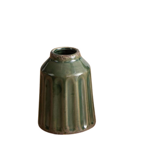 Add a beautifully textured grey-green vase to your decor this year! This 6" vase has a textured indent stripe going down it's side. Add some florals, drapey greenery or just display it with some other pottery to change things up.

&nbsp;6" H x 4" Dia

Ceramic