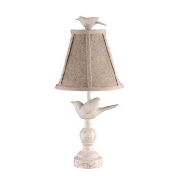 Inspired by a hand-carved design, this Bird Accent Lamp in neutral colors, is topped with a playful lampshade that is lined a bird toile fabric. A great way to add light & nature to any room.

25 watt bulb not included

8