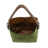 Equally timeless and modern, our best-selling classic hobo is made in rich vegan leather in a beautiful dark emerald faux suede, accented with a brown strap.&nbsp; This roomy bag, accented with a large front pocket and a snap-in removable brown crossbody, has plenty of room to carry your needs in style.