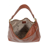 This oversized, slouchy, cool hobo bag is made of tumbled buffalo grain cinnamon-colored vegan leather, which gives it that casual boho chic look! With two included removable shoulder straps, you can wear it as a short shoulder bag or a crossbody bag.