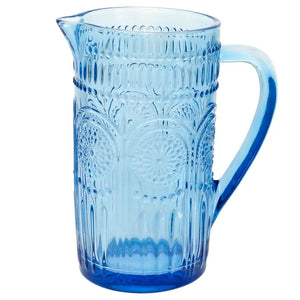 This pretty blue glass pitcher is a nod to times gone by! It's a beautifully crafted pitcher with an intricate raised pattern that adds a touch of sophistication to any table setting.&nbsp;

7" L x 4.5" W x 7.75" H

Hand wash only, not dishwasher safe, not microwave safe.