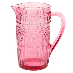 This pretty pink glass pitcher is a nod to times gone by! It's a beautifully crafted pitcher with an intricate raised pattern that adds a touch of sophistication to any table setting.&nbsp;

7" L x 4.5" W x 7.75" H

Hand wash only, not dishwasher safe, not microwave safe.