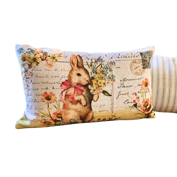This adorable vintage postcard pillow has a bunny holding a floral bouquet - it will bring a vintage flair to your spring decor this year! The reverse side has a blue and white stripe fabric on it.

 9