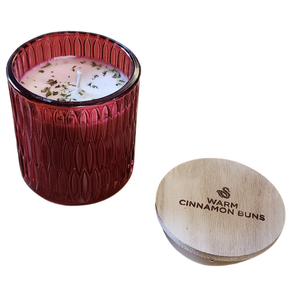 You'll love our newest cathedral glass tumbler! This warm cinnamon buns candle has been poured into a pretty red patterned glass and comes with a wooden lid.

You don’t need the fair for sticky buns! A high throw of cinnamon with a mild buttery cake throw will have you waiting for more!

Filled with 6.5 oz. of American Soybean WaxTM. Measures 3.25