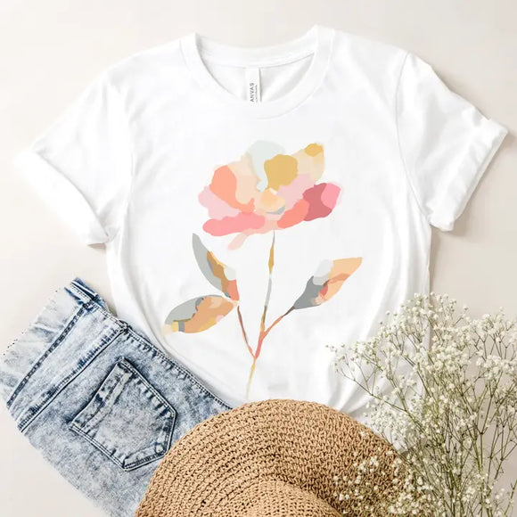 You'll get tons of compliments with this crisp white t-shirt! On the front is a single watercolor flower with stem in a gorgeous watercolor mosaic pattern in several shades of coral and grey blues and grey greens!

Made in the USA
