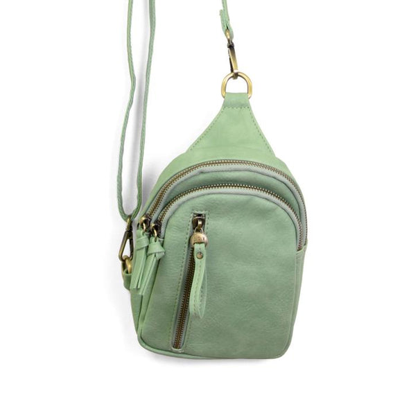 Blending uptown chic with downtown cool, the Skyler sling bag is made in rich wispy green vegan leather! A convertible strap lends versatility, while a front zip pocket offers practical storage for your necessities. It is the perfect companion for a night out on the town or a fun day trip!


8