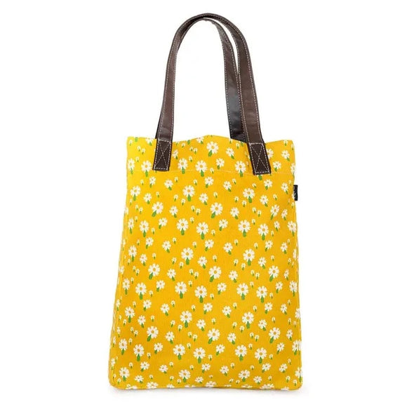 These sweet daisies on a yellow background make such a cute & happy print! All of our bags are printed on recycled canvas with eco-friendly pigment inks. Our canvas totes are soft yet durable, and an easy carry-all. Not just for the market. This streamlined tote features an interior strap and hooks to attach our pouches. Printed on recycled canvas with eco-friendly pigment inks. Can we say hooray?
