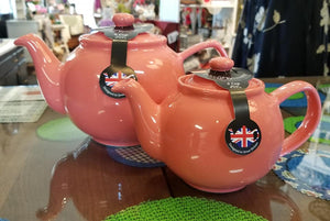 Flamingo colored teapots in 2-cup and 6-cup sizes
