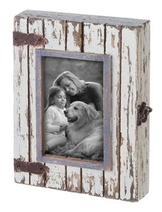 Add a bit of rugged charm to your space with this rustic wood box frame. With distressed whitewashed wood and metal hardware, this photo box displays one 4 x 6" photo in the lid and there is a latch that will open the frame to store your favorite trinkets & knick-knacks.