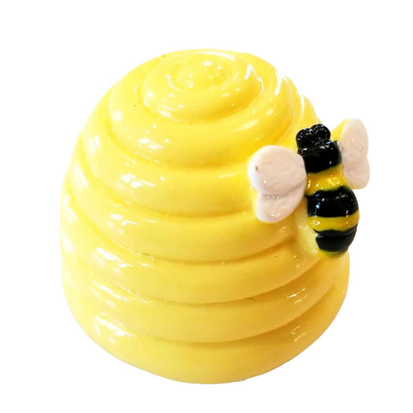 This honey-vanilla-scented lip gloss shaped like a yellow beehive may be the cutest thing you can buy today! There is a bee along the side as decoration. The lipgloss opens at the bottom.