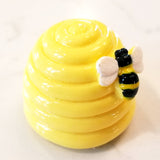 This honey-vanilla-scented lip gloss shaped like a yellow beehive may be the cutest thing you can buy today! There is a bee along the side as decoration. The lipgloss opens at the bottom.