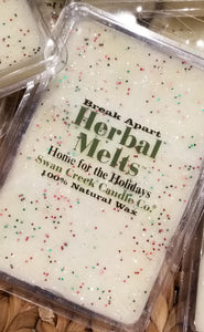Herbal Melts "Home for the Holidays" cream wax in a rectagle plastic case with red and green glitter sprinkled through it in 6 break-a-way blocks.  