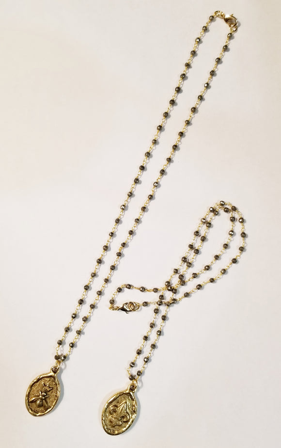 A fabulous addition to your jewelry collection, our Queen Bee Necklace pulls double duty. With a Queen bee on one side and fleur de Lis on the other, it can be worn two ways.  Necklace 18