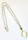 We love this Labradorite necklace with a brushed gold Moroccan-inspired shaped pendant. We have a feeling that it will become your favorite staple in your jewelry box!  Approximately 30” long. 