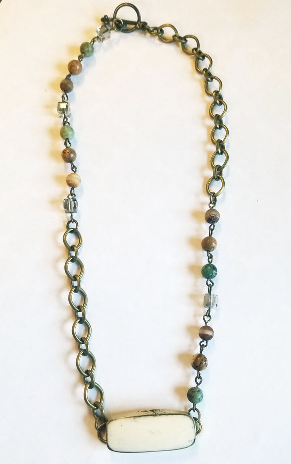 We love that you have the option to wear this beautiful bone/African turquoise piece as a choker or as a bracelet (you have to love a piece that does double duty!!)  Toggle closure. Approximately 14